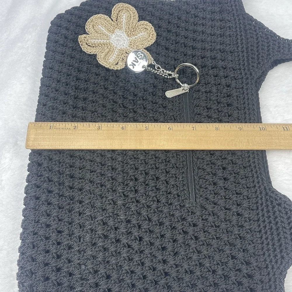 The Sak Black Crochet Shoulder Bag Boho Knit Purse Charm Flower NWOT
